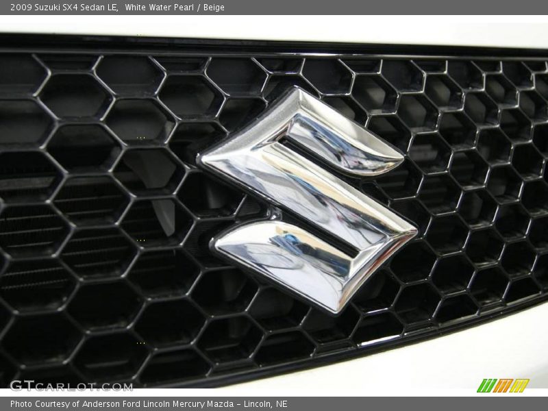 White Water Pearl / Beige 2009 Suzuki SX4 Sedan LE