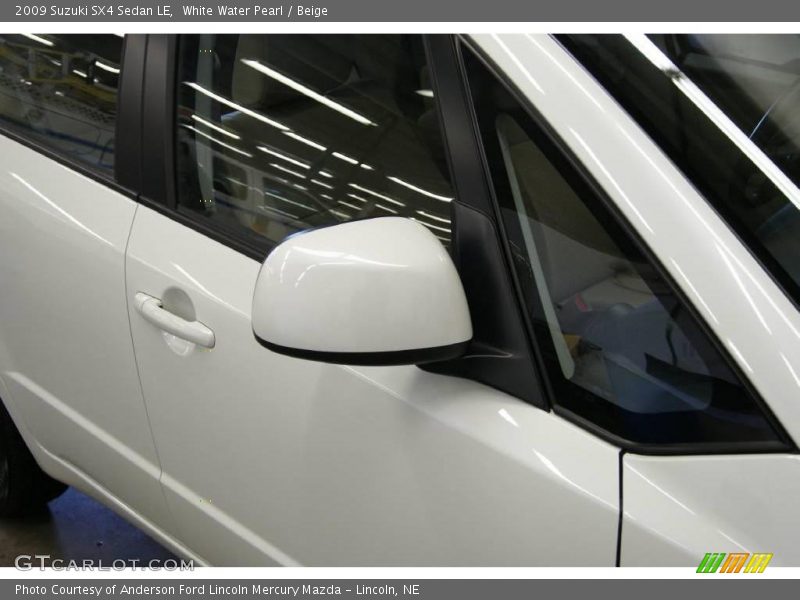 White Water Pearl / Beige 2009 Suzuki SX4 Sedan LE