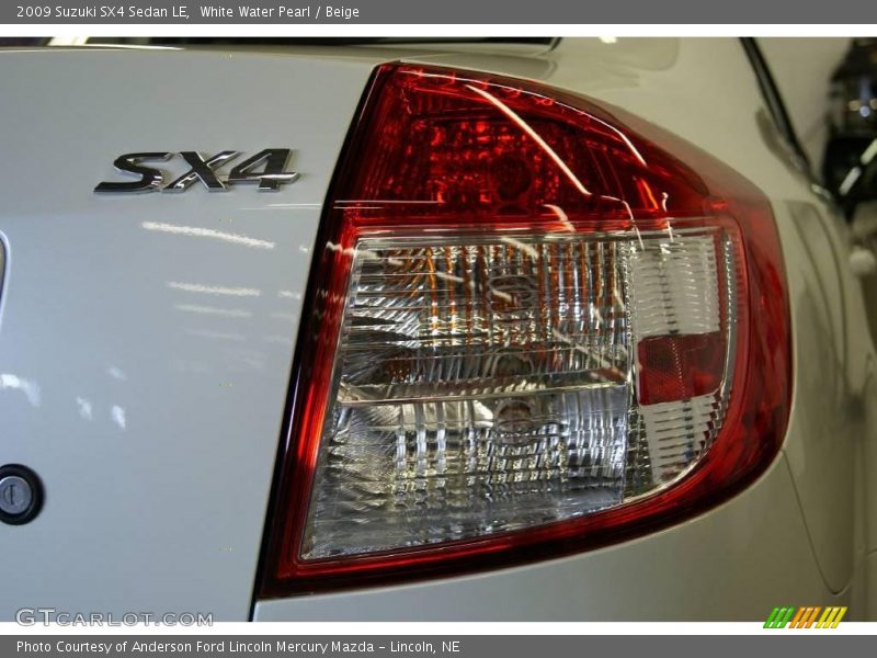 White Water Pearl / Beige 2009 Suzuki SX4 Sedan LE