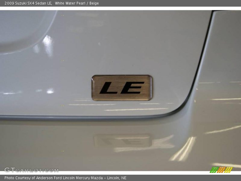 White Water Pearl / Beige 2009 Suzuki SX4 Sedan LE