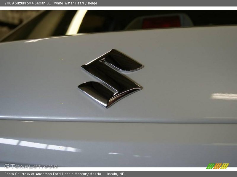 White Water Pearl / Beige 2009 Suzuki SX4 Sedan LE