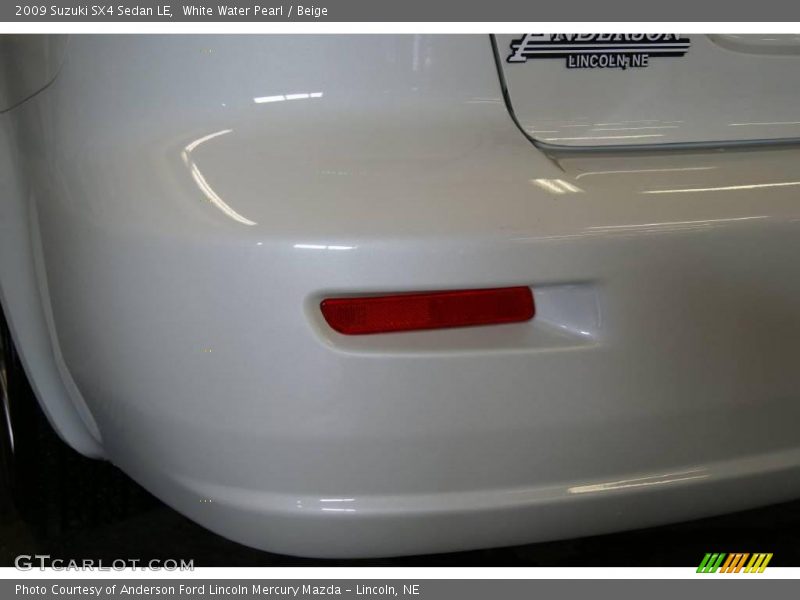 White Water Pearl / Beige 2009 Suzuki SX4 Sedan LE