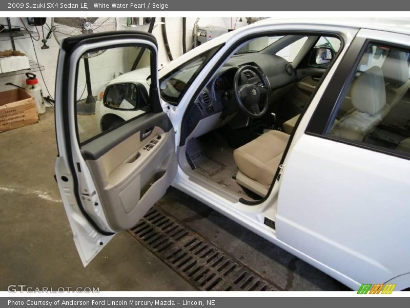 White Water Pearl / Beige 2009 Suzuki SX4 Sedan LE