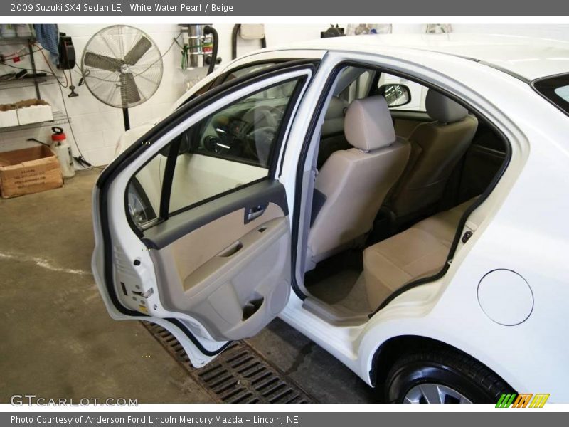 White Water Pearl / Beige 2009 Suzuki SX4 Sedan LE