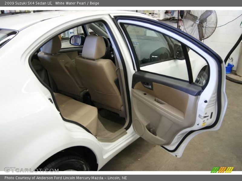 White Water Pearl / Beige 2009 Suzuki SX4 Sedan LE