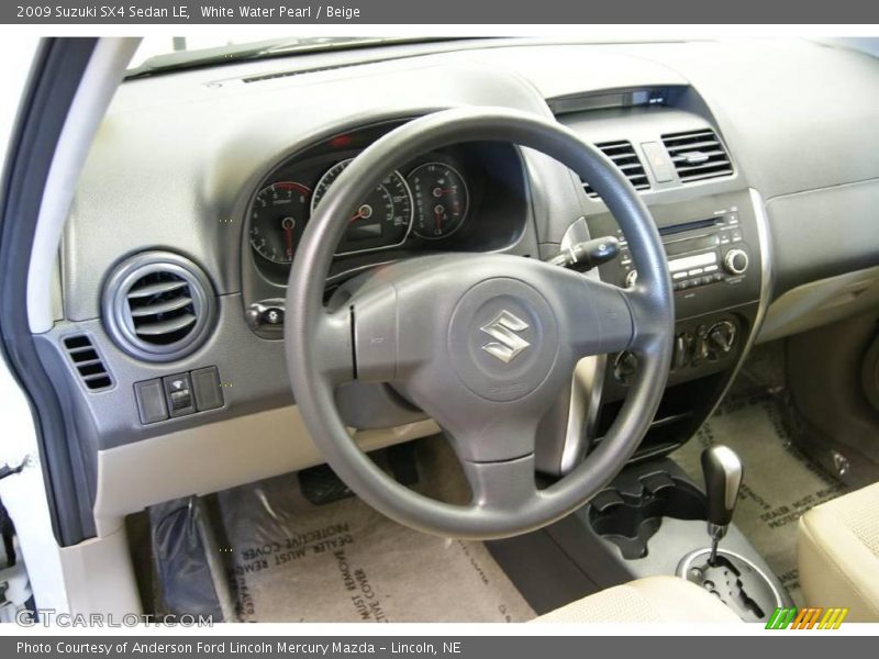 White Water Pearl / Beige 2009 Suzuki SX4 Sedan LE