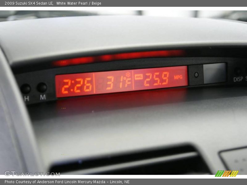 White Water Pearl / Beige 2009 Suzuki SX4 Sedan LE
