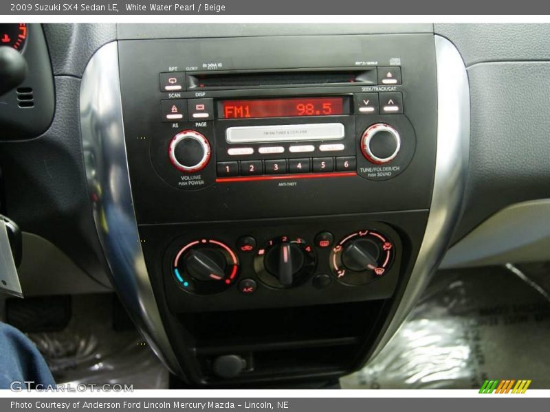 White Water Pearl / Beige 2009 Suzuki SX4 Sedan LE