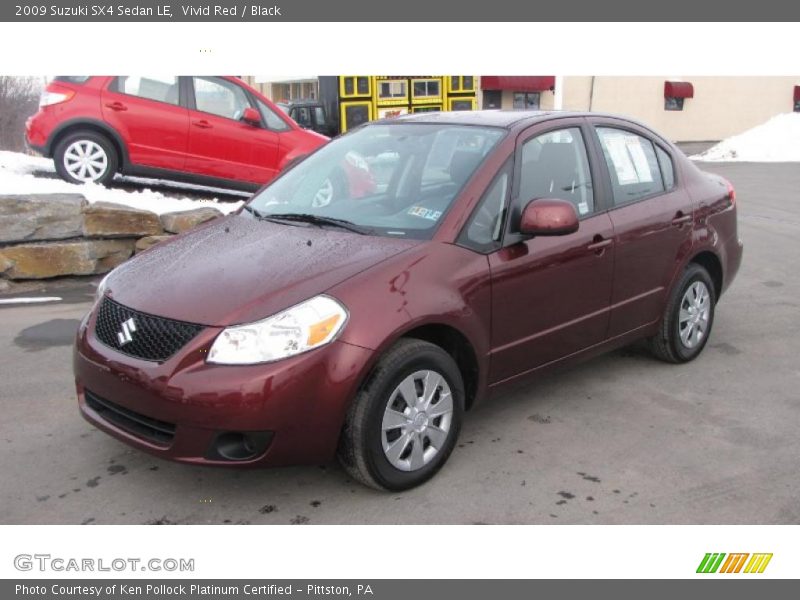 Vivid Red / Black 2009 Suzuki SX4 Sedan LE