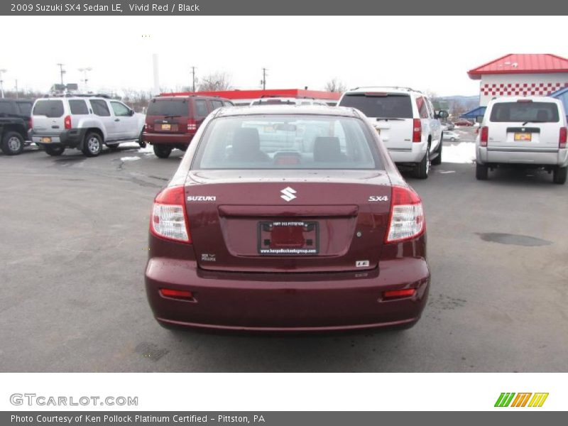 Vivid Red / Black 2009 Suzuki SX4 Sedan LE