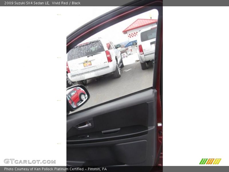 Vivid Red / Black 2009 Suzuki SX4 Sedan LE
