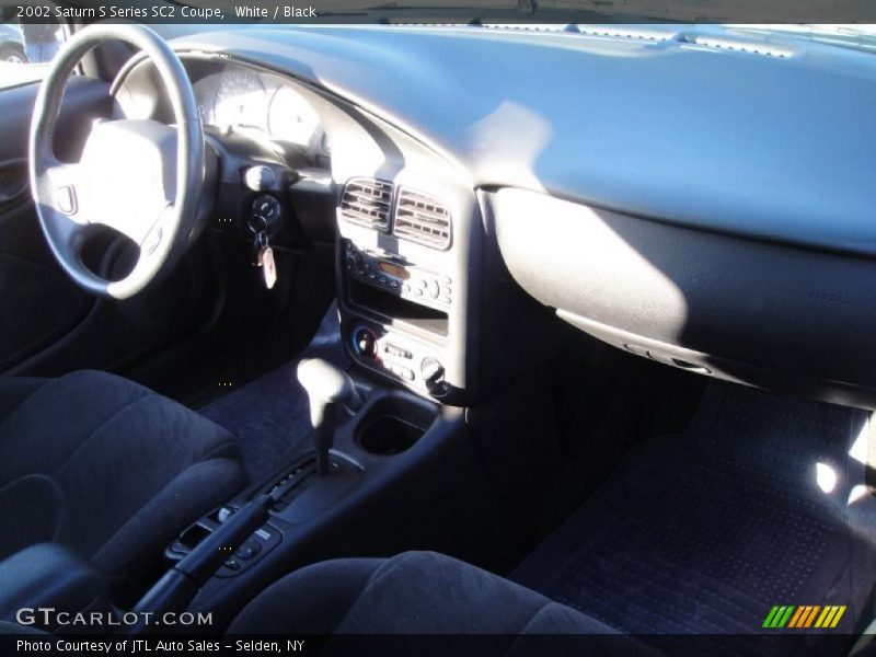White / Black 2002 Saturn S Series SC2 Coupe