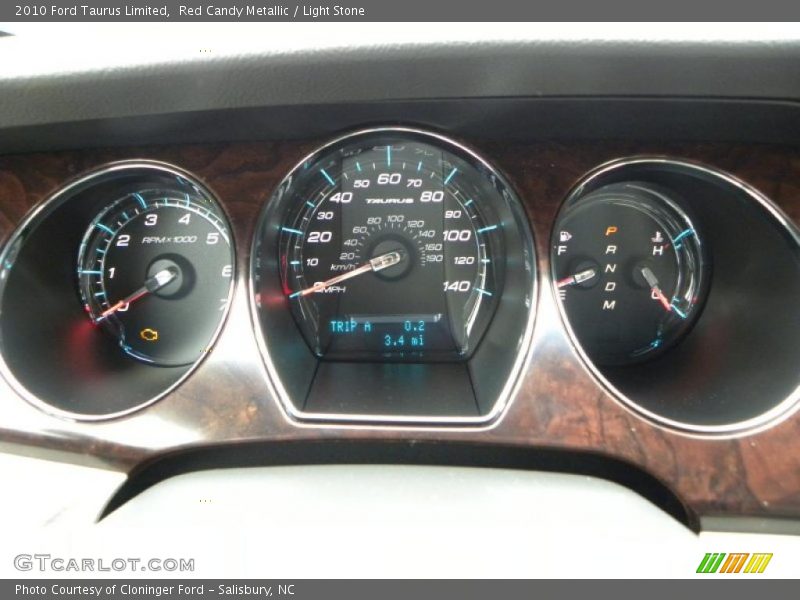 Red Candy Metallic / Light Stone 2010 Ford Taurus Limited
