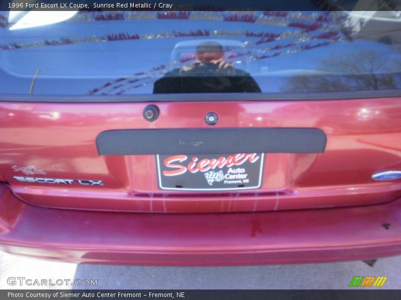 Sunrise Red Metallic / Gray 1996 Ford Escort LX Coupe