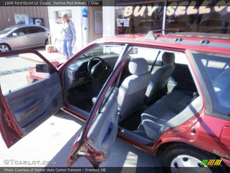 Sunrise Red Metallic / Gray 1996 Ford Escort LX Coupe