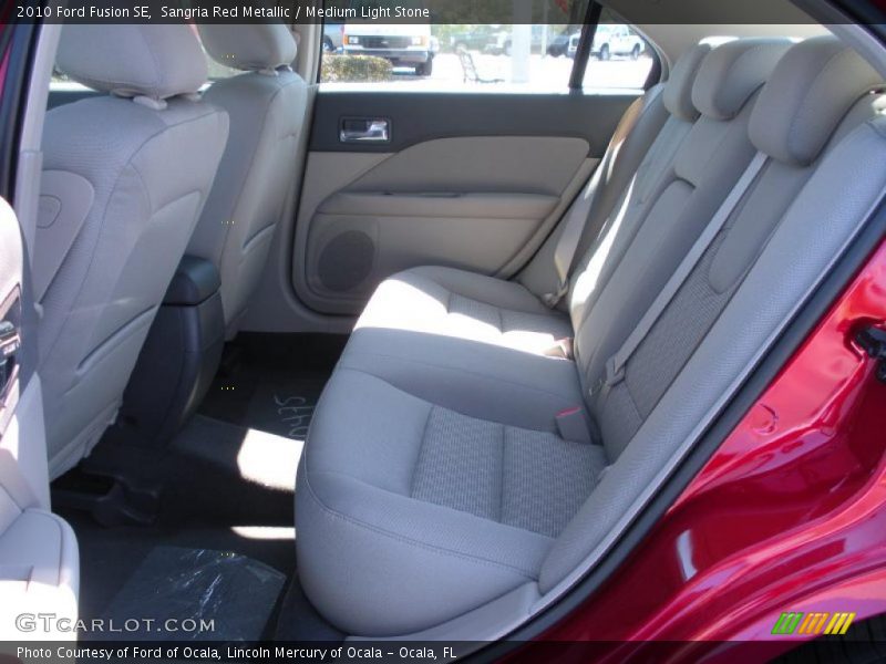 Sangria Red Metallic / Medium Light Stone 2010 Ford Fusion SE