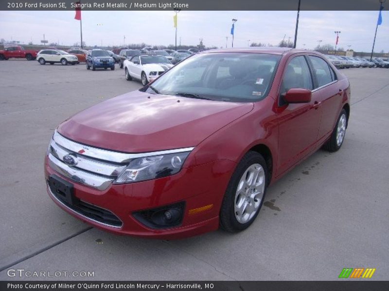 Sangria Red Metallic / Medium Light Stone 2010 Ford Fusion SE