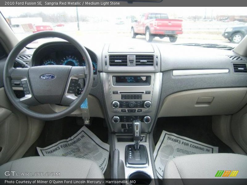 Sangria Red Metallic / Medium Light Stone 2010 Ford Fusion SE