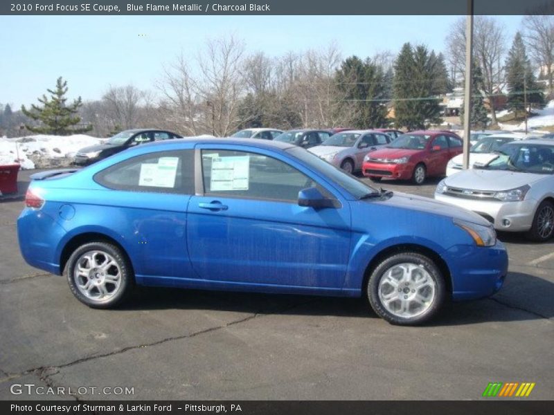 Blue Flame Metallic / Charcoal Black 2010 Ford Focus SE Coupe