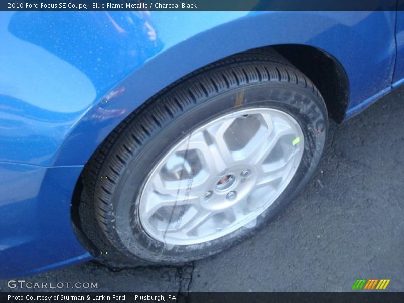 Blue Flame Metallic / Charcoal Black 2010 Ford Focus SE Coupe