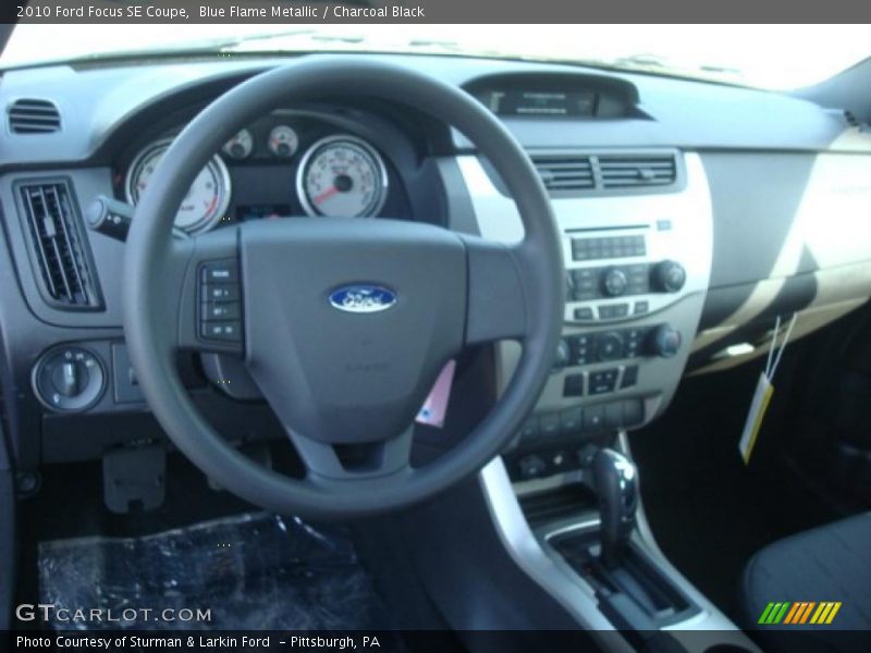 Blue Flame Metallic / Charcoal Black 2010 Ford Focus SE Coupe