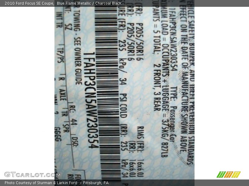 Blue Flame Metallic / Charcoal Black 2010 Ford Focus SE Coupe