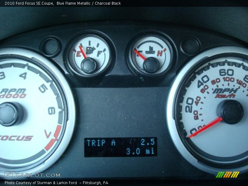 Blue Flame Metallic / Charcoal Black 2010 Ford Focus SE Coupe