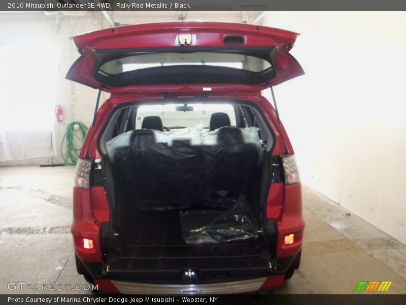 Rally Red Metallic / Black 2010 Mitsubishi Outlander SE 4WD