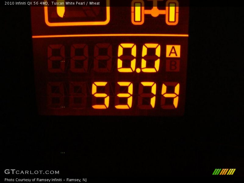 Tuscan White Pearl / Wheat 2010 Infiniti QX 56 4WD