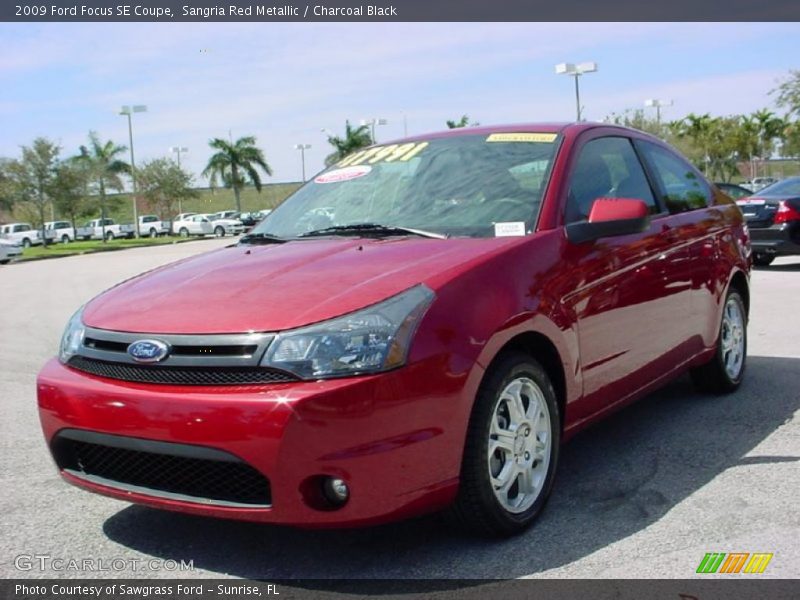 Sangria Red Metallic / Charcoal Black 2009 Ford Focus SE Coupe