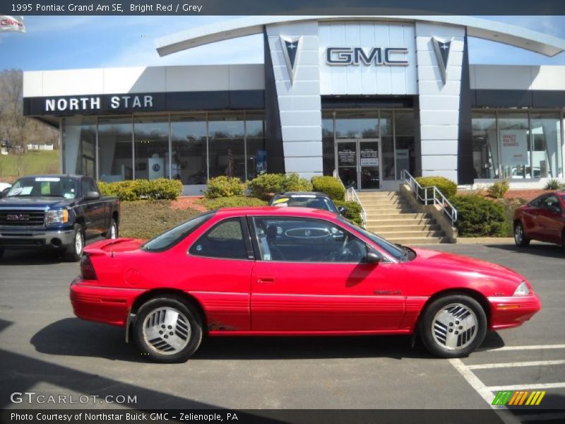 Bright Red / Grey 1995 Pontiac Grand Am SE