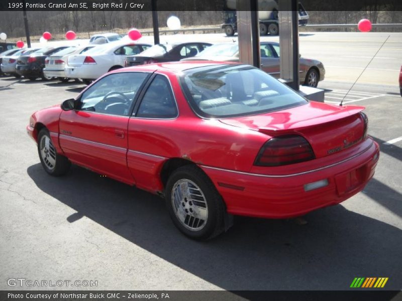 Bright Red / Grey 1995 Pontiac Grand Am SE