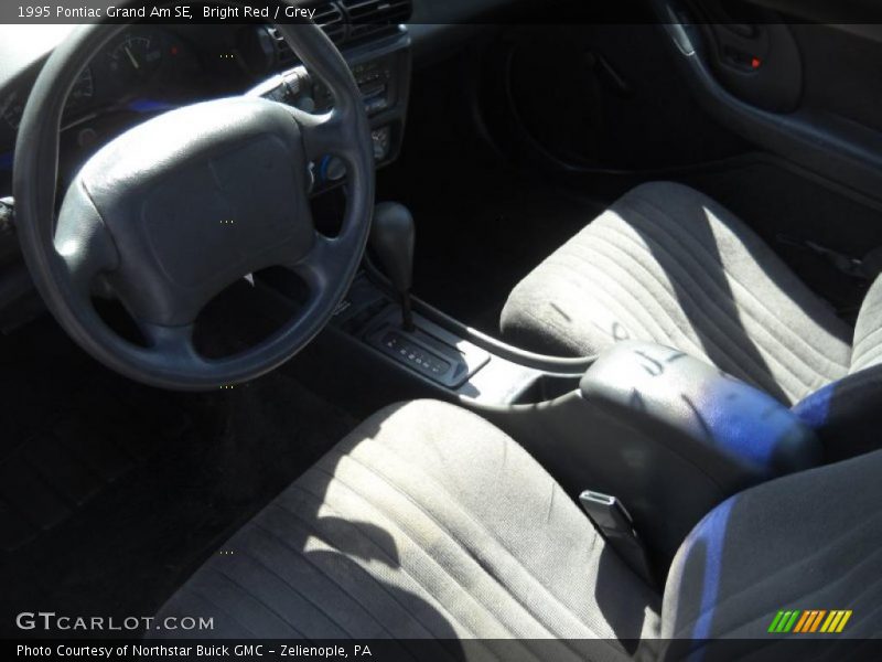 Bright Red / Grey 1995 Pontiac Grand Am SE
