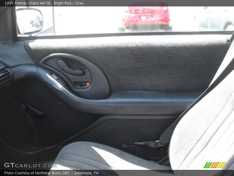 Bright Red / Grey 1995 Pontiac Grand Am SE