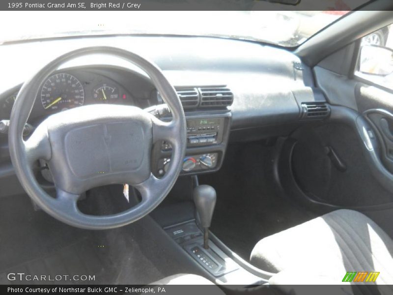 Bright Red / Grey 1995 Pontiac Grand Am SE