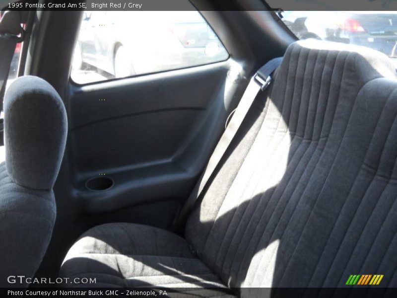 Bright Red / Grey 1995 Pontiac Grand Am SE
