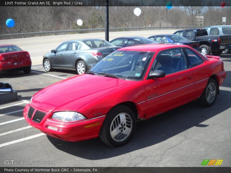 Bright Red / Grey 1995 Pontiac Grand Am SE