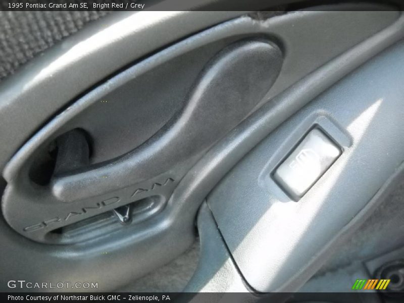 Bright Red / Grey 1995 Pontiac Grand Am SE