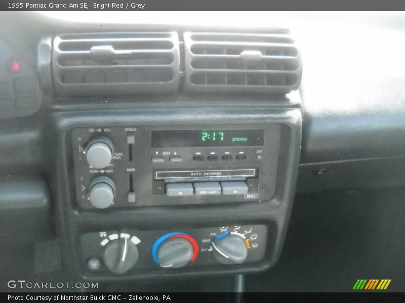 Bright Red / Grey 1995 Pontiac Grand Am SE