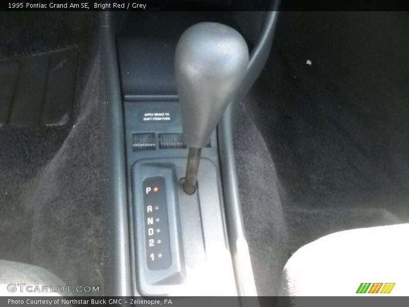 Bright Red / Grey 1995 Pontiac Grand Am SE