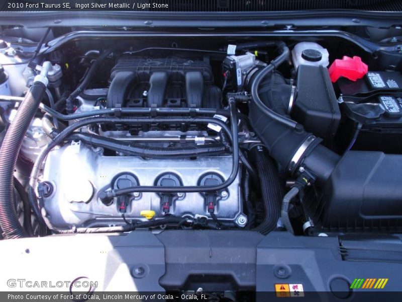Ingot Silver Metallic / Light Stone 2010 Ford Taurus SE