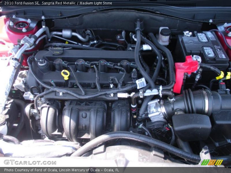 Sangria Red Metallic / Medium Light Stone 2010 Ford Fusion SE