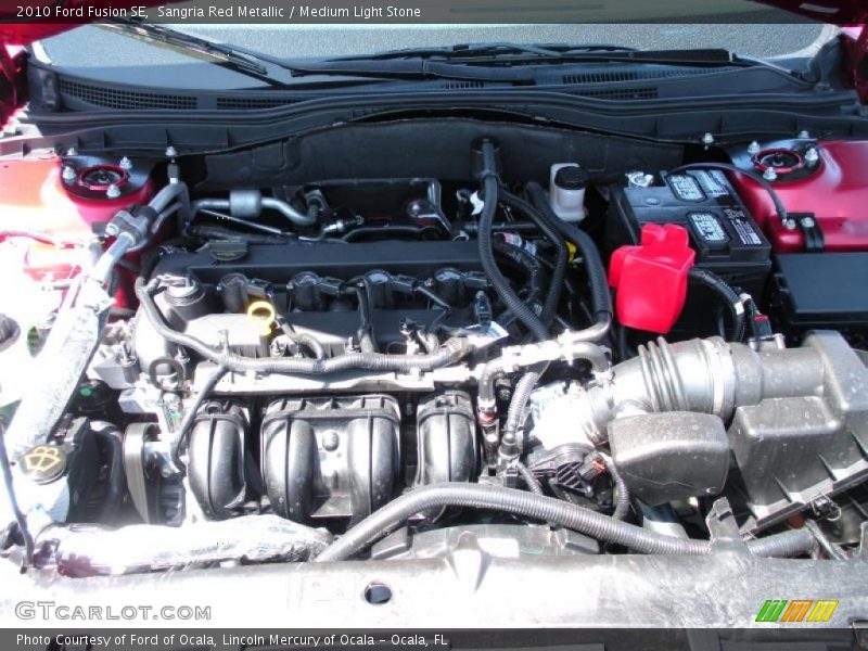 Sangria Red Metallic / Medium Light Stone 2010 Ford Fusion SE