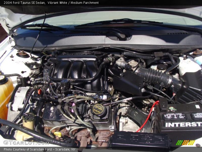 Vibrant White / Medium Parchment 2004 Ford Taurus SE Sedan