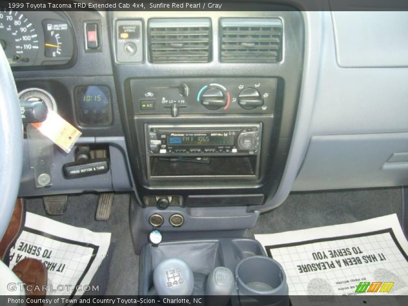Sunfire Red Pearl / Gray 1999 Toyota Tacoma TRD Extended Cab 4x4