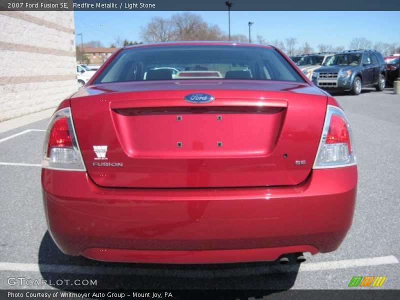 Redfire Metallic / Light Stone 2007 Ford Fusion SE