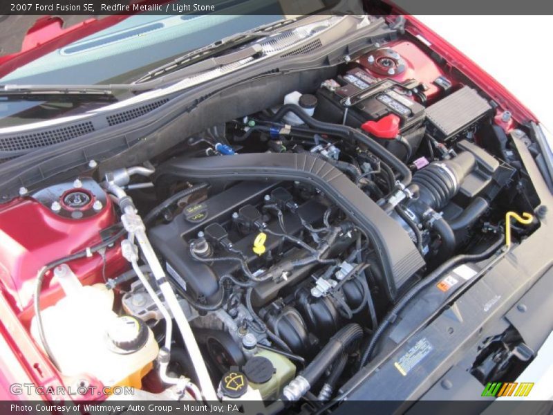 Redfire Metallic / Light Stone 2007 Ford Fusion SE