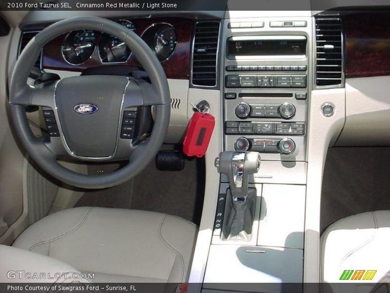 Cinnamon Red Metallic / Light Stone 2010 Ford Taurus SEL