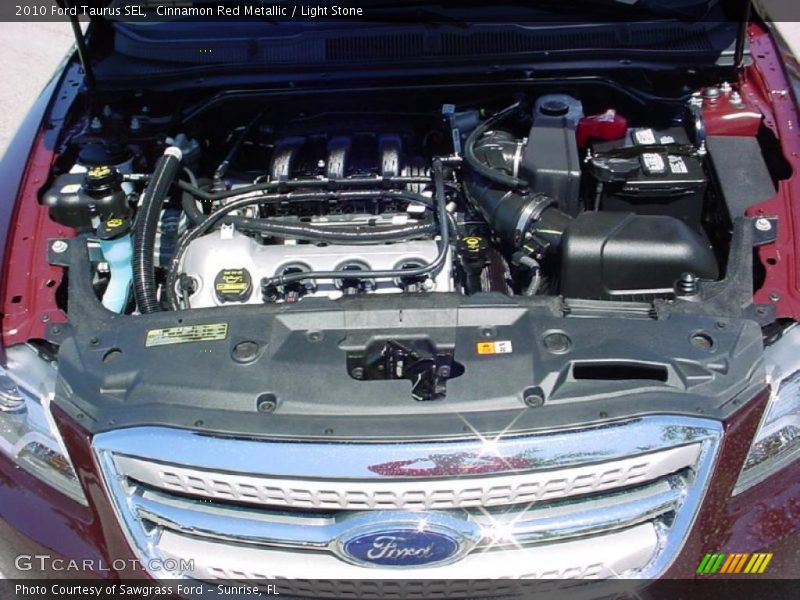 Cinnamon Red Metallic / Light Stone 2010 Ford Taurus SEL