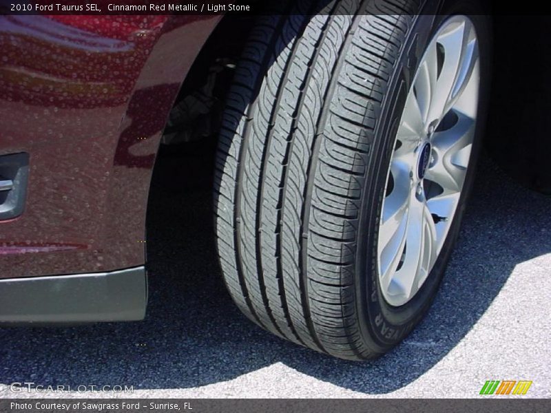 Cinnamon Red Metallic / Light Stone 2010 Ford Taurus SEL